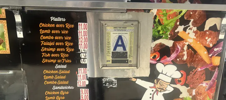 NYC food truck permit sticker with A grade